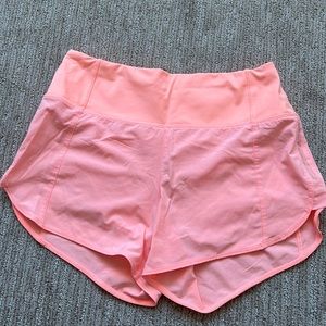 Athleta bright pink running shorts. Built in underwear. Back zipper pocket